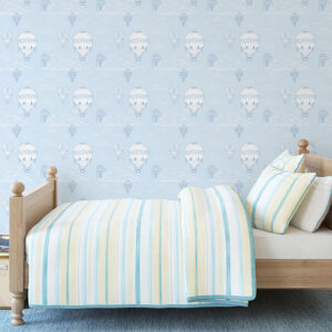 Blue background with white hot air balloon pattern printed on peel and stick wallpaper in America