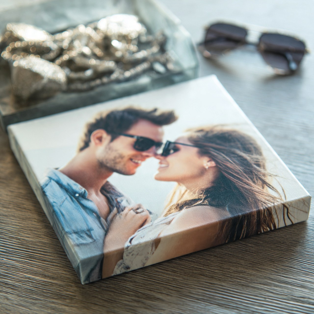 10x10 stretched canvas print with photo of a couple on a table with sunglasses