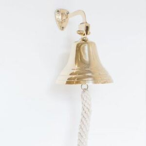 Gold dinner bell on wall home decor accessory